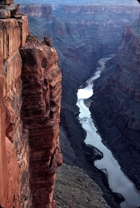 Looking down from a 3000 foot tall cliff to a river at the bottom of the gorge