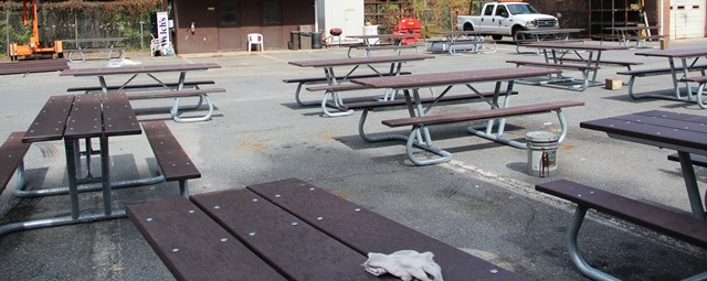 a pictures of fifteen tables that were assembled by volunteers