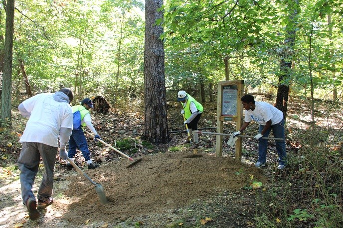 volunteers on a trail in the forest of Greenbelt Park