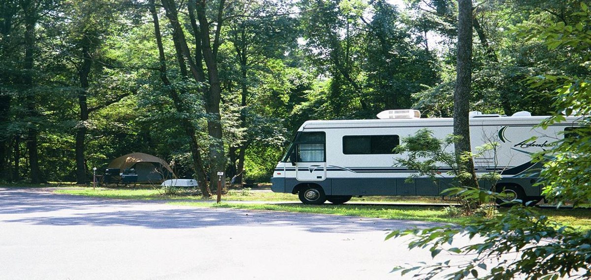 a picture of a RV and a tent in the Greenbelt Park campground a picture of a RV and a tent in the Greenbelt Park campground