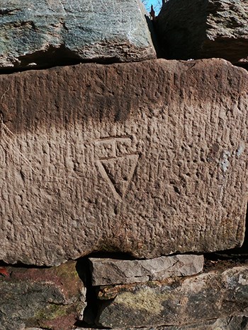 Here is an image a Mason Mark on a large red Seneca Sandstone brick at Lock 02