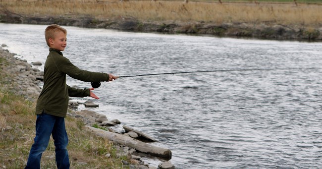 A young boy fishing