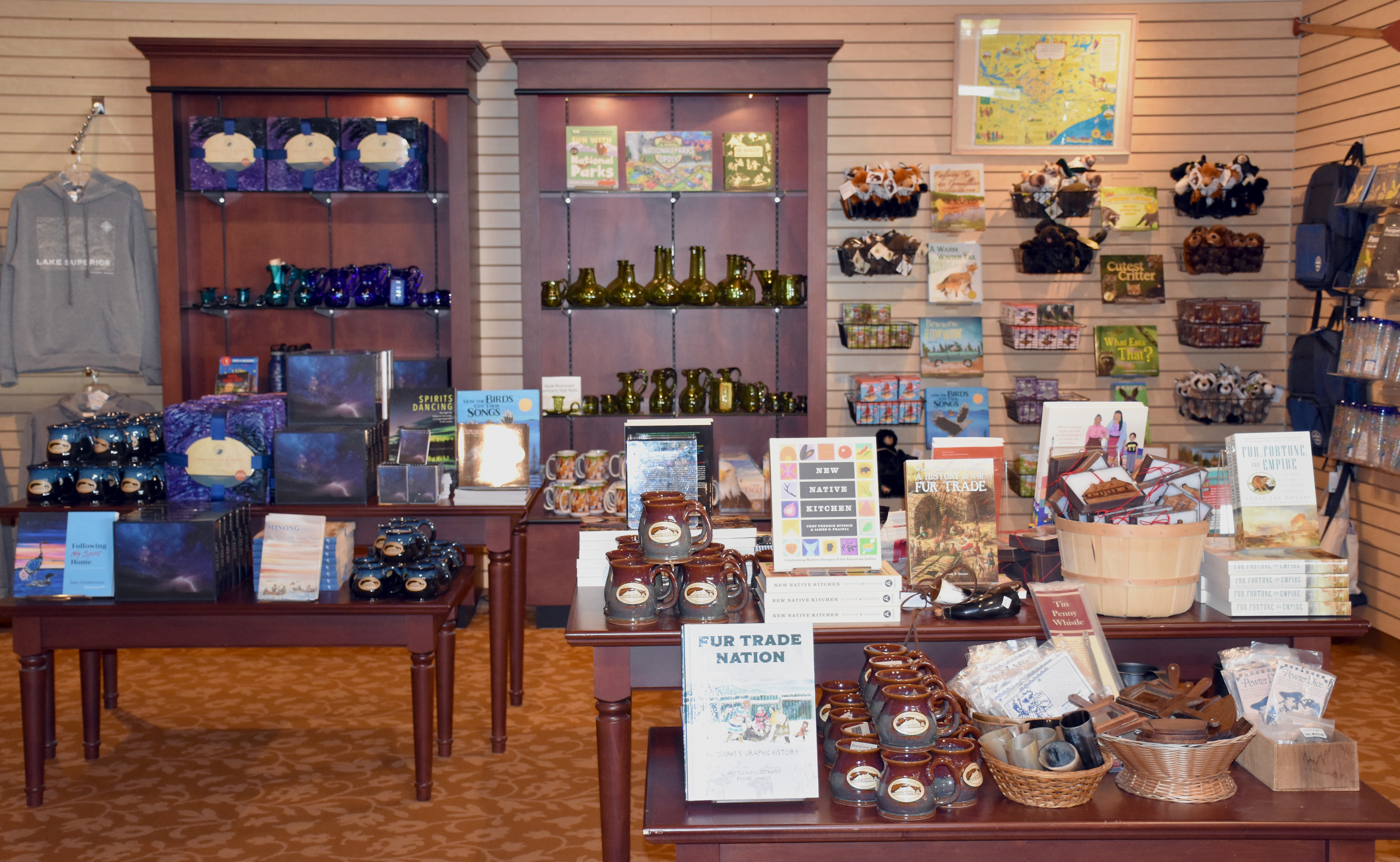 Books and other merchandise on tables and shelves.