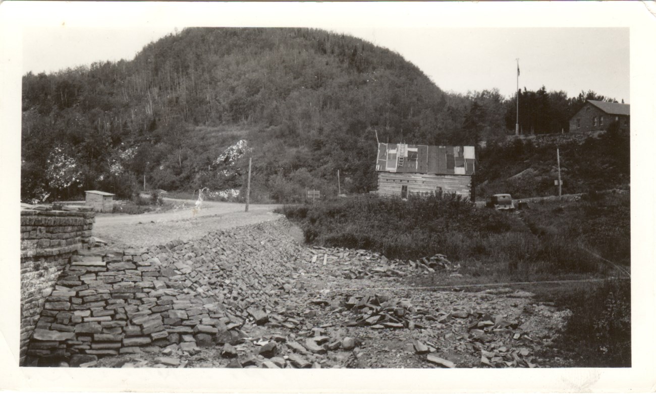 Historic black and white photo of stonework supporting a bridge