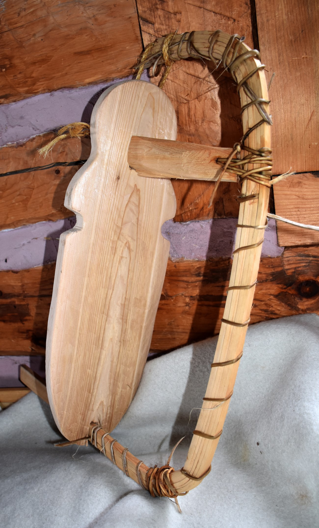 Man board A bent cedar form to shape the bow or stern of the canoe.