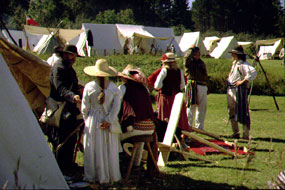 Historical reenactors catch up on news during Rendezvous Days. Historical reenactors catch up on news during Rendezvous Days.