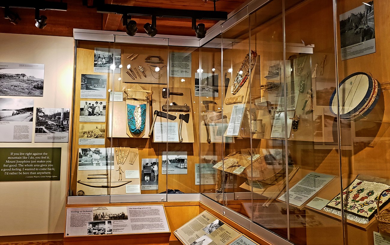 Detail of an exhibit case with examples of Anishinaabe culture.