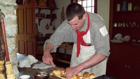 Baker butters bread.