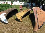 Birchbark canoes turned upside down make waterproof "homes" for voyageurs in the historic encampment.