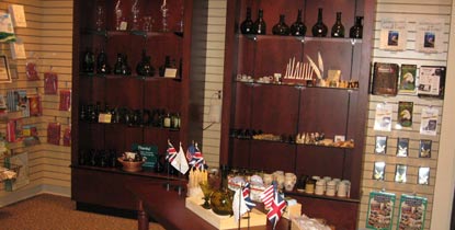 Cabinets in the EN bookstore are filled with historic glass and ceramic reproduction items similar to artifacts discovered in the Monument.