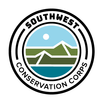 round logo with desert motif with text Southwest Conservation Corps