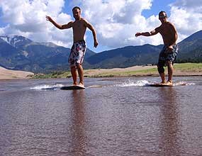 Skimboarders on Medano Creek