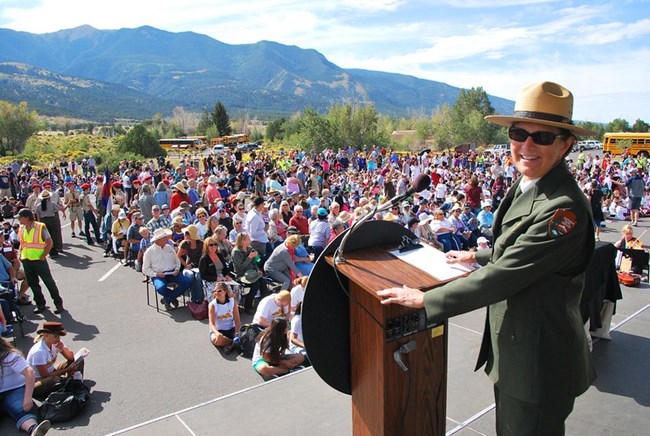 Superintendent Lisa Carrico prepares to speak to a huge crowd at the dunes in 2014