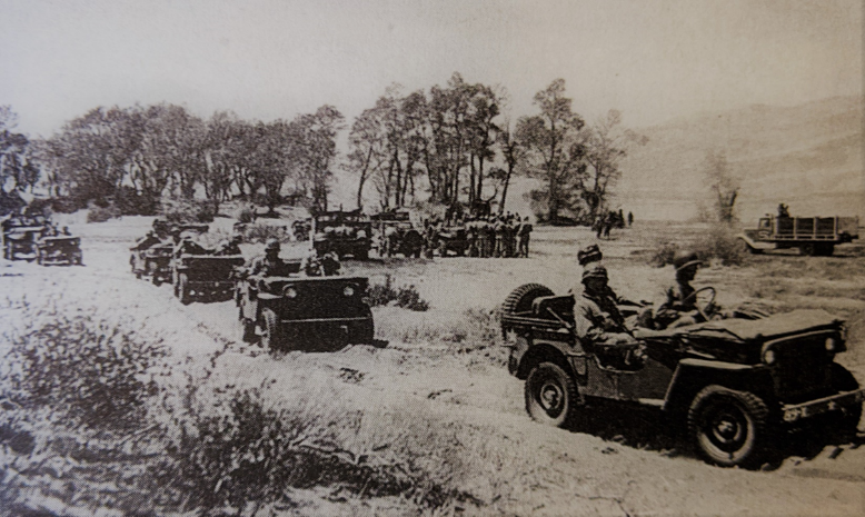 Military jeeps drive near the dunes in 1942