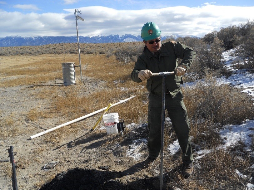 Park Geologist Andrew Valdez collects data in Great Sand Dunes National Park and Preserve.