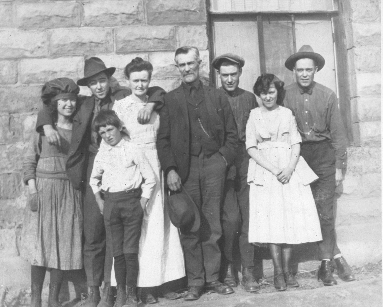 Historical family photo of the Wellington family in front of a building