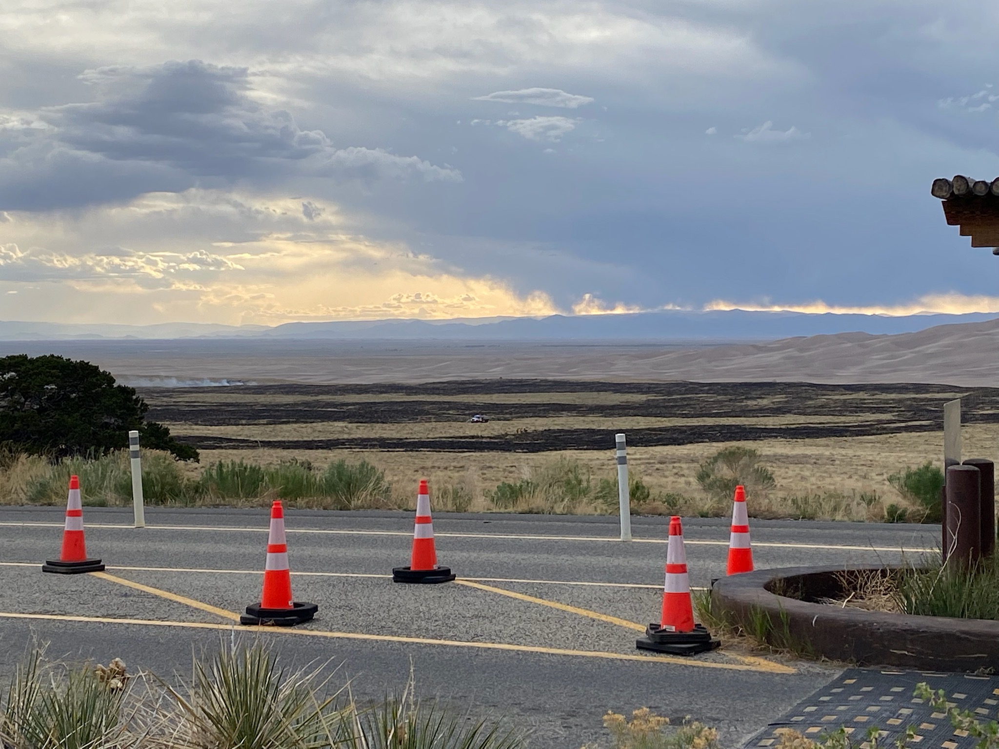 A view from the park entrance station to burned grasslands and dunes