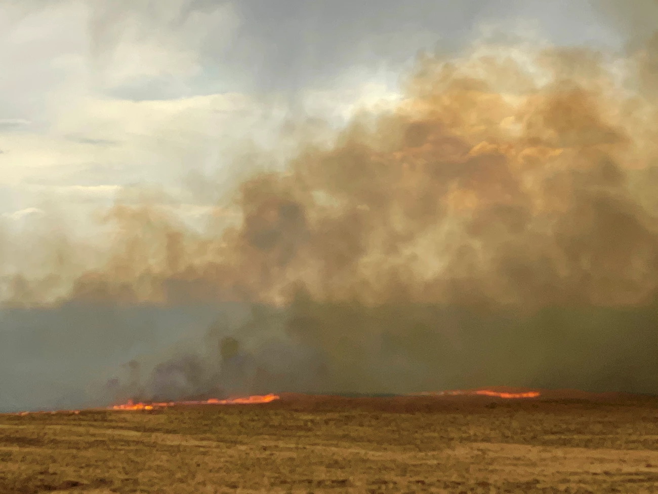 Medano Fire May 18 A line of wildfire burns through grasslands southwest of the dunes
