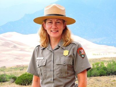 Superintendent Pam Rice Superintendent Pam Rice with Dunes and Mountains in Background