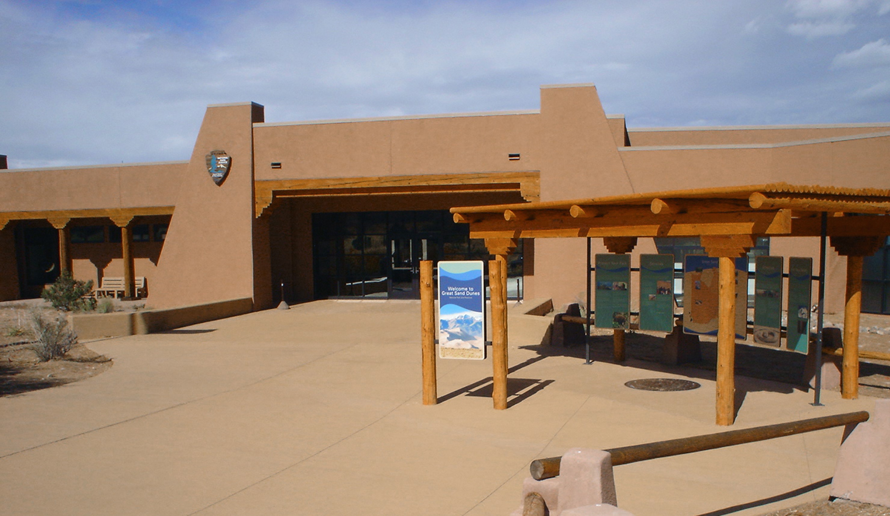 Great Sand Dunes Visitor Center, an adobe-styled stucco building.