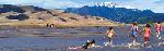 Panorama of Children in Medano Creek Dunes and Mt Herard