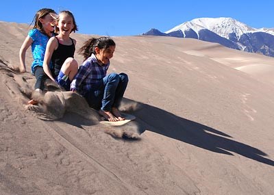 Girls Sand Sledding Girls Sand Sledding