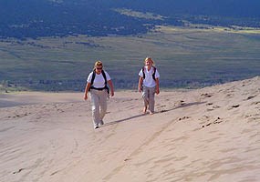hikers on the dunes hikers on the dunes