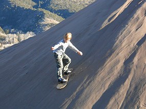 sandboarding sand dunes national park boy sledding colorado desert planyourvisit grsa nps gov preserve nov2 neatorama waves alamosa