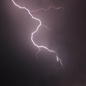Lightning illuminates a dark sky
