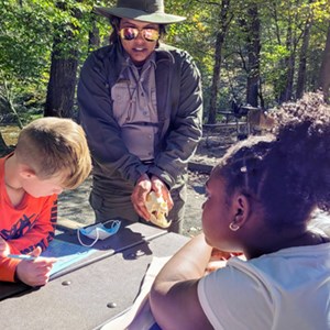Ranger showing students an animal skull