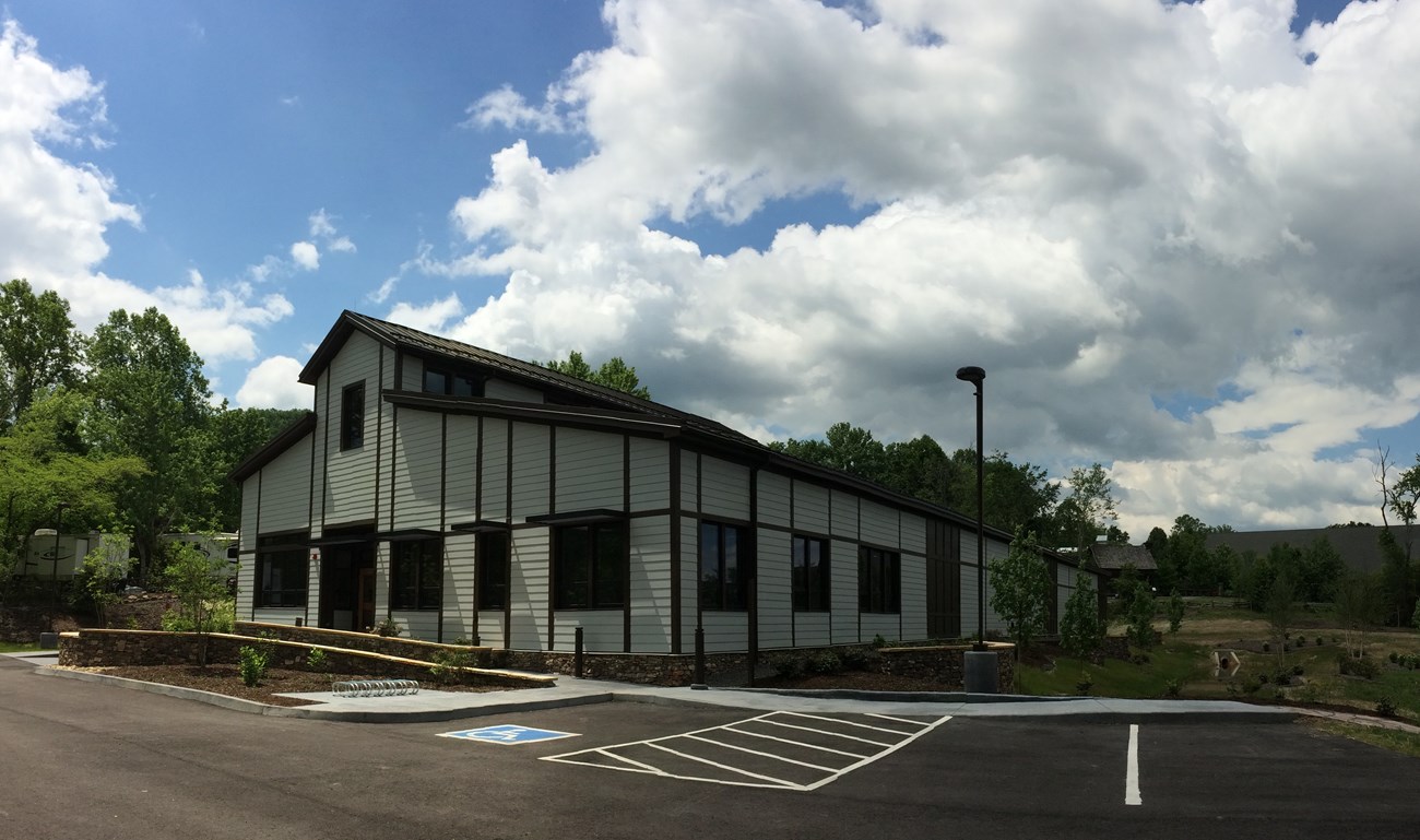 View of northeast corner of the Collections Preservation Center shortly after construction was completed showing the front and side facades.