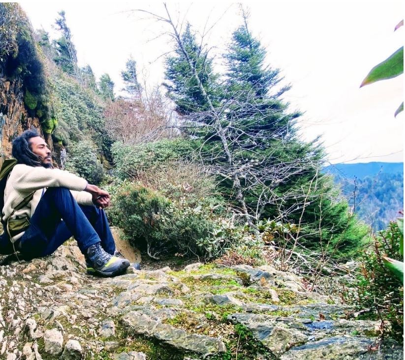 Daniel White sitting on the Appalachian Trail.