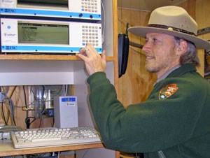 Jim Renfro inside the Look Rock monitoring station.
