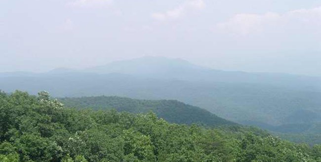 View from the Look Rock Tower showing the mountains obscured by haze.