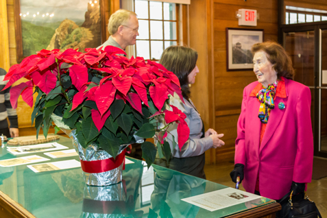 Rangers welcome Wanneta Johnson who donates a poinsettia every year on the anniversary of her son's rescue.