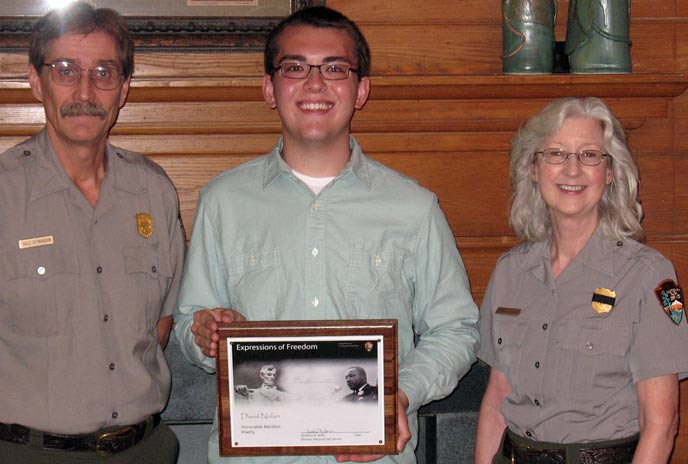 David Noland accepting award from Superintendent Dale Ditmanson and Chief of Resource Education, Elizabeth Dupree.