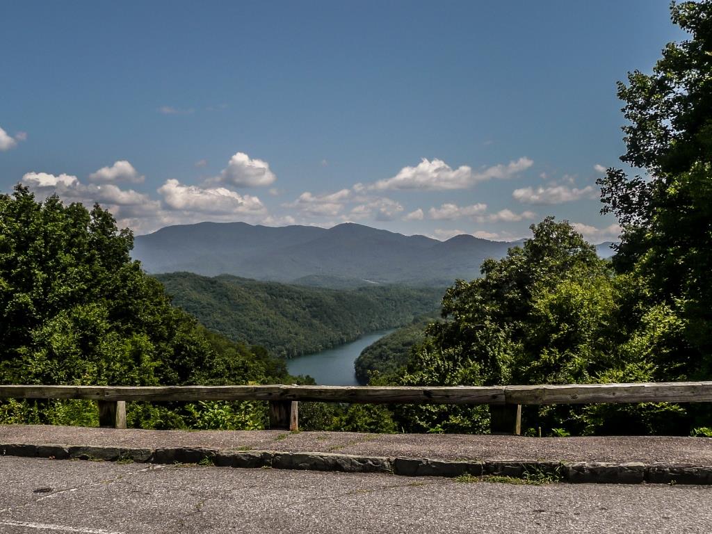 A strip of Fontana Lake is seen among trees and mountains along Lakeview Drive