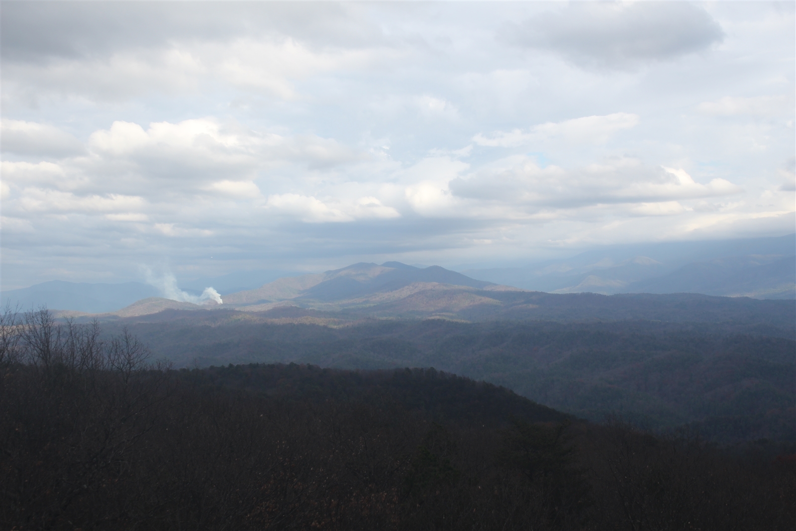 smoke plume in distant mountains