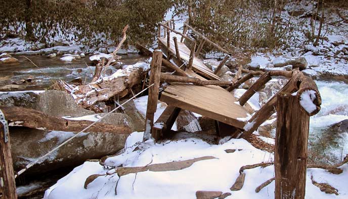 A bridge that was twisted and damaged by floods.