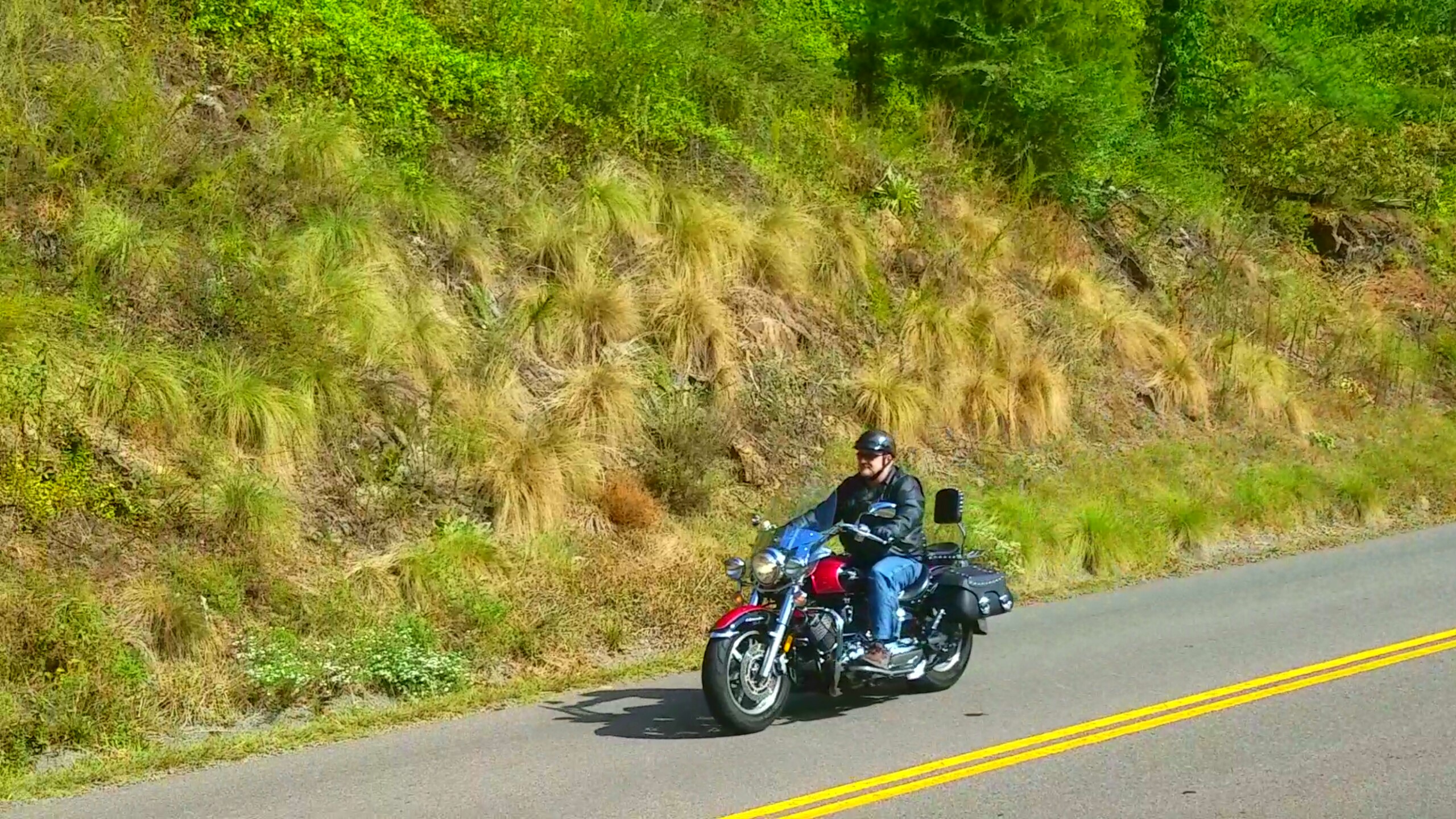 A motorcyclist on a road.
