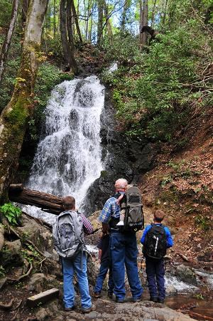 Family of five facing Cataract Falls