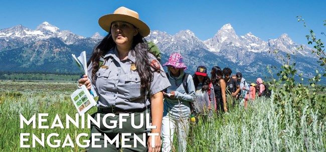 Ranger leads a hike of students with the Teton range behind and title "Meaningful Engagement"
