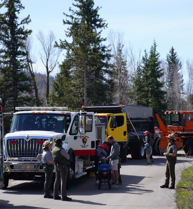 Park rangers show families various large vehicles on Junior Ranger Day