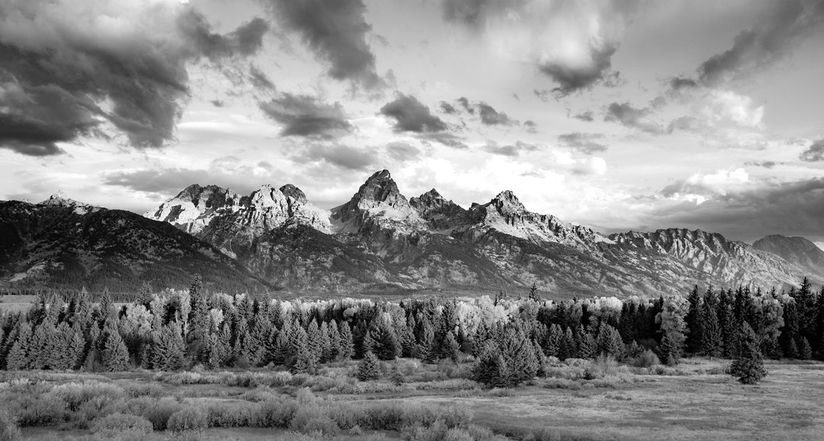 Panoramic view of the jagged Teton Range in black and white