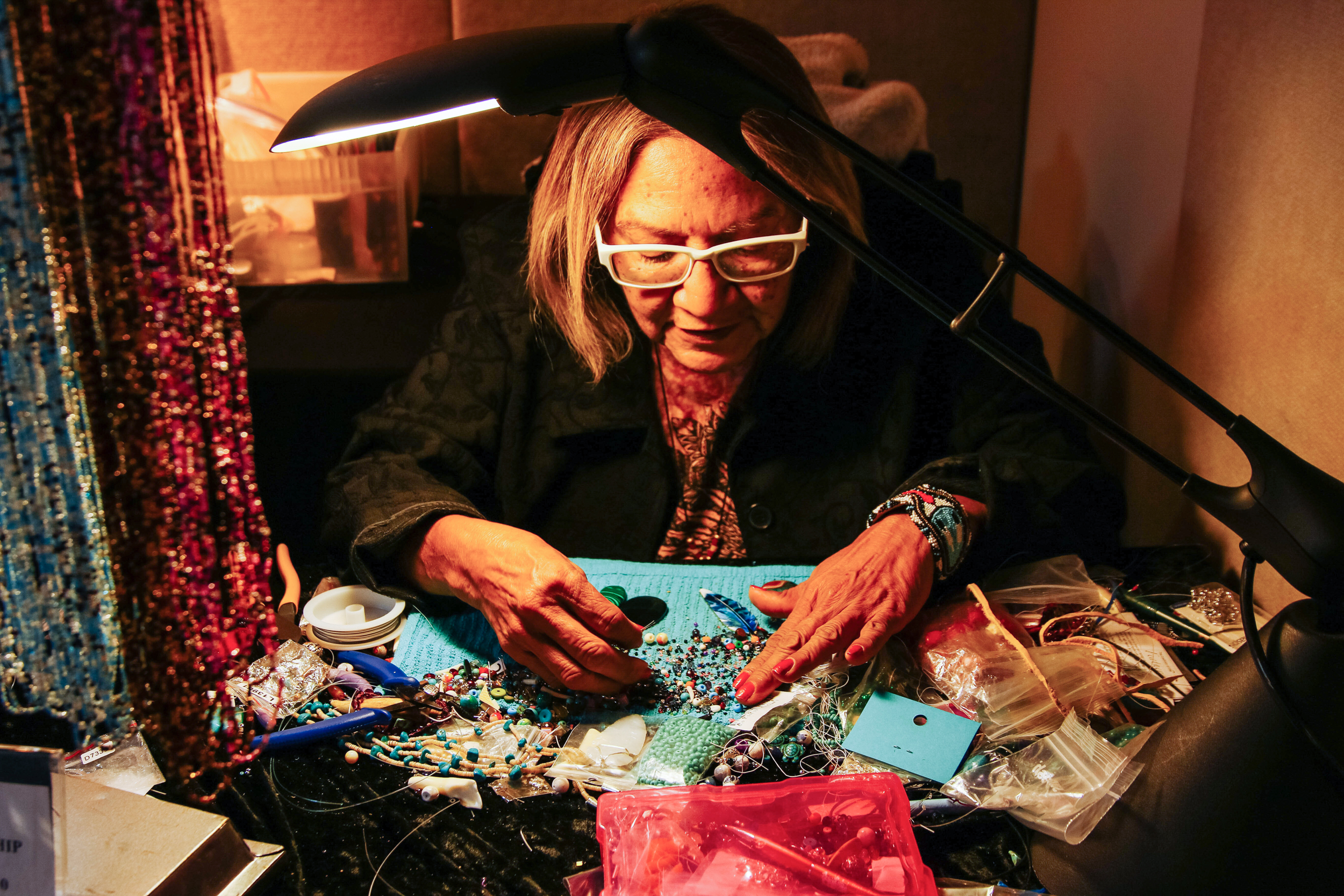 Artist Debbie La Mere works with beads at the Colter Bay Visitor Center