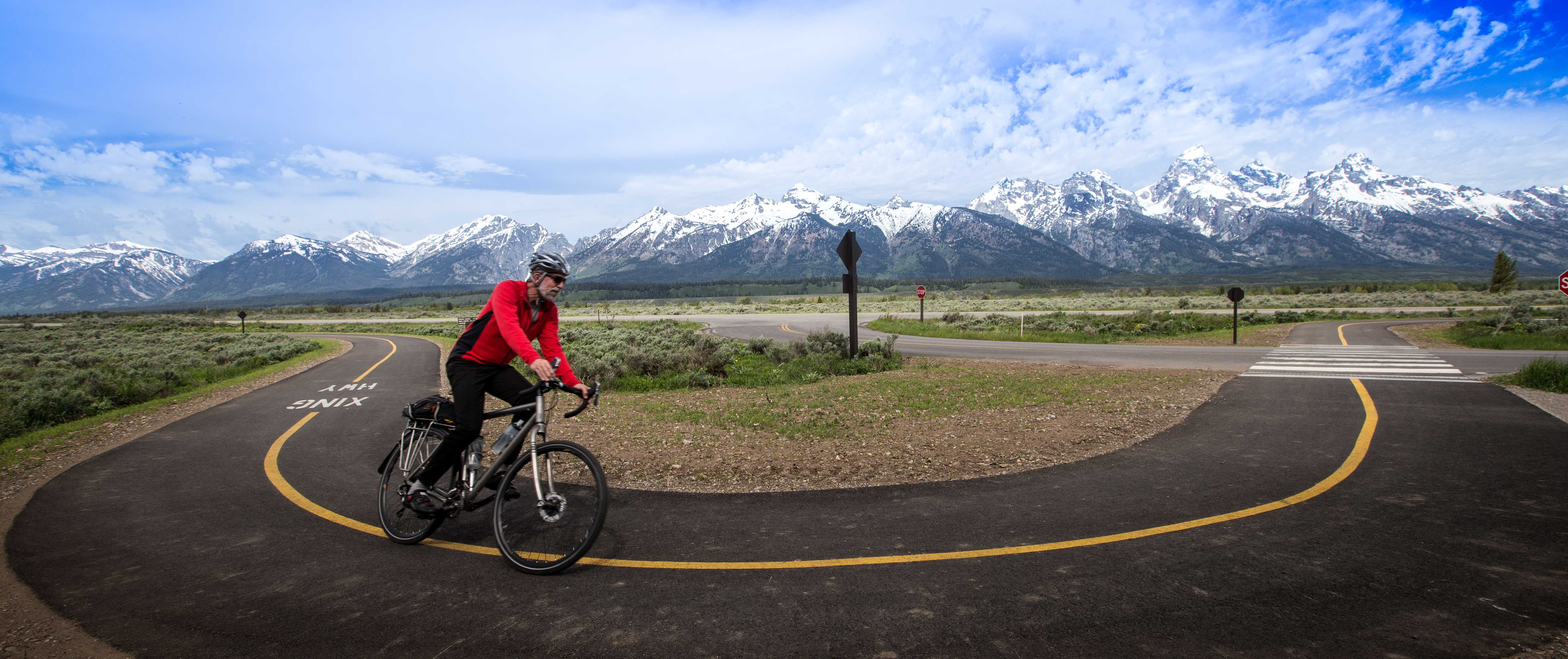 Bicycle rider using the pathway in Grand Teton