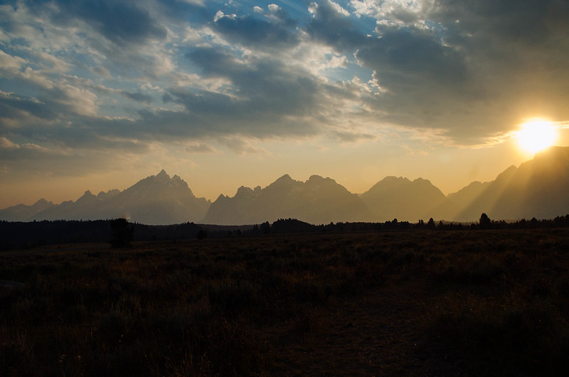 Sun sets behind the Teton Range