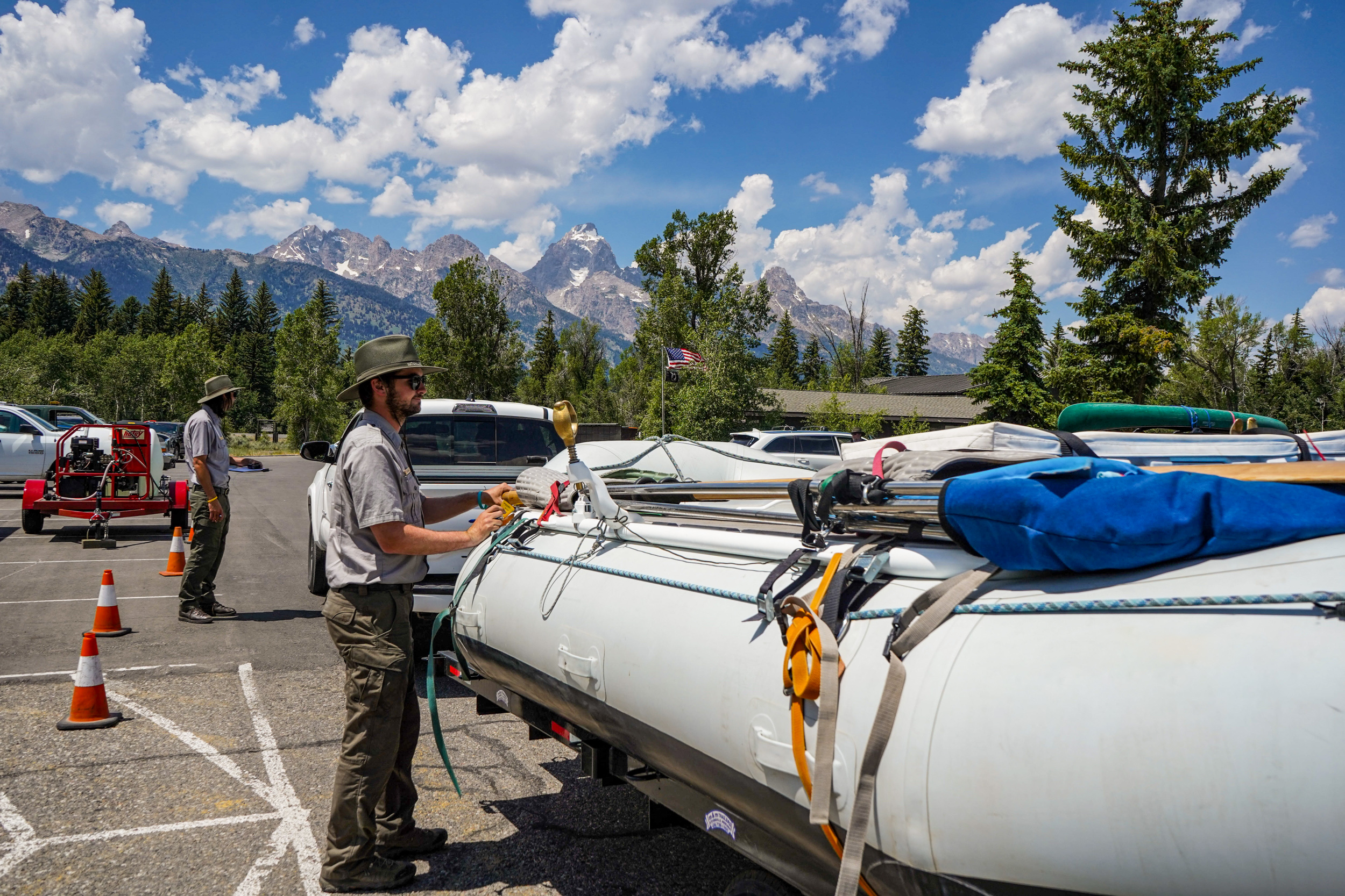 Grand Teton park staff inspect a boat at the Moose watercraft inspection station