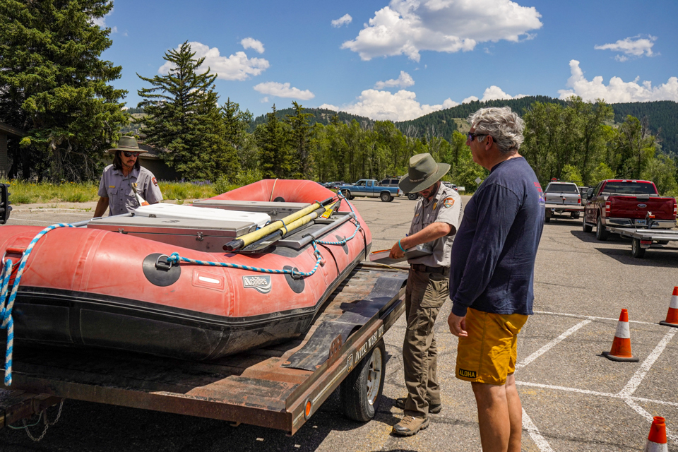 Grand Teton staff inspect raft for aquatic invasive species