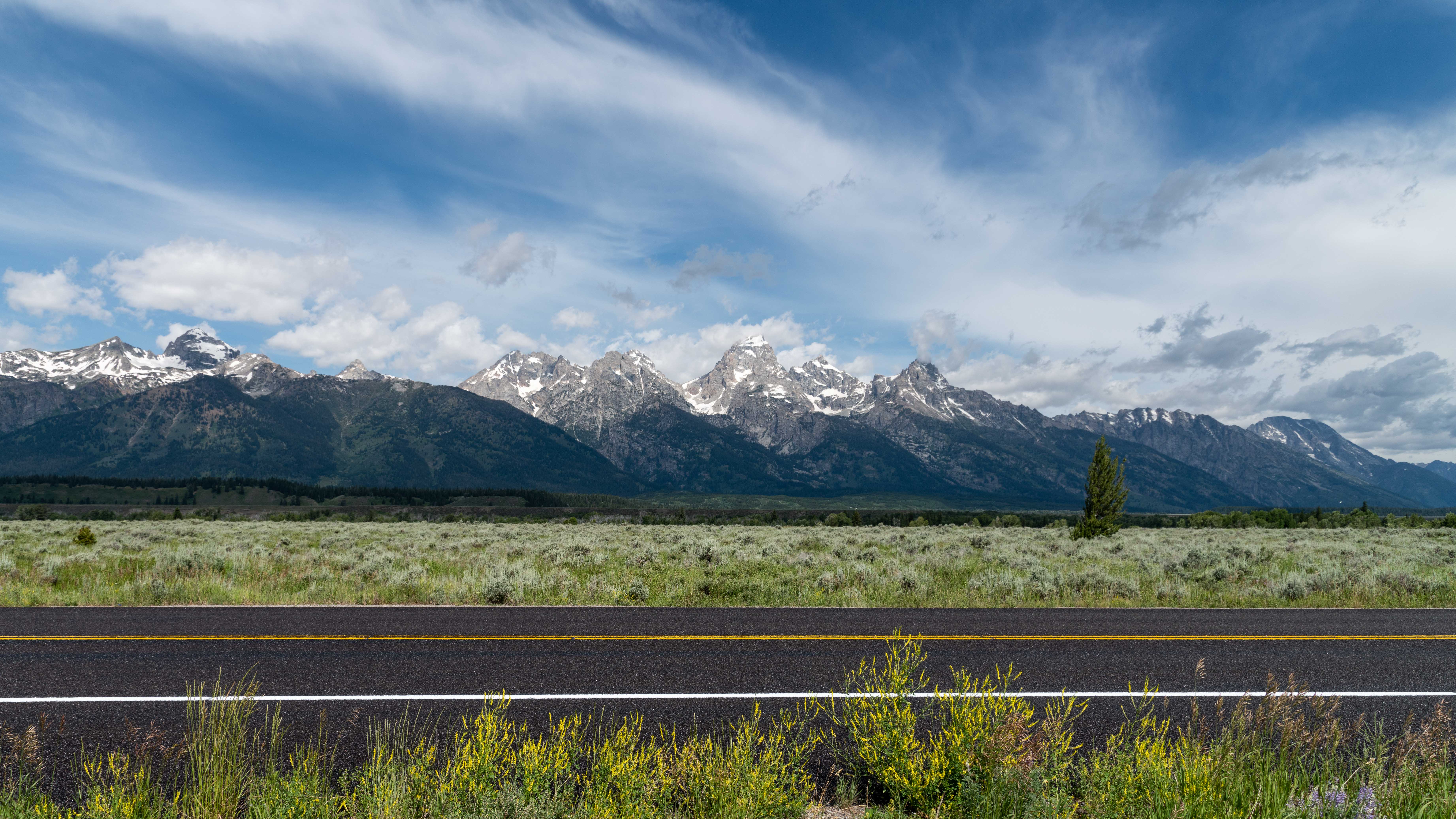 Freshly fog sealed roadway along U.S. Highway 89 Freshly fog sealed roadway along U.S. Highway 89 with the Teton Range in the background.